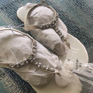 Unworn ivory sandals.